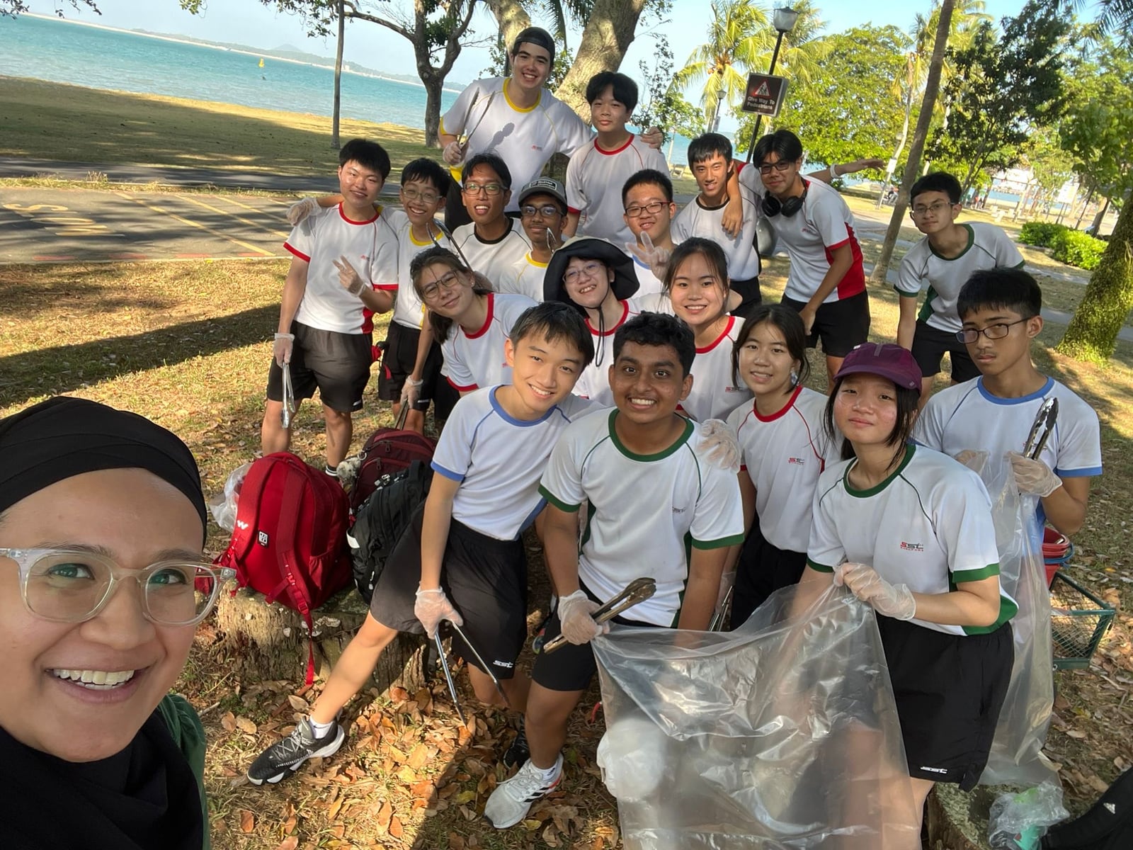 Yi Kai Tan and classmates after cleaning Changi Beach